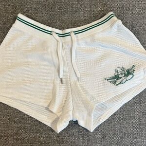 White Athletic Shorts with Green Accents
